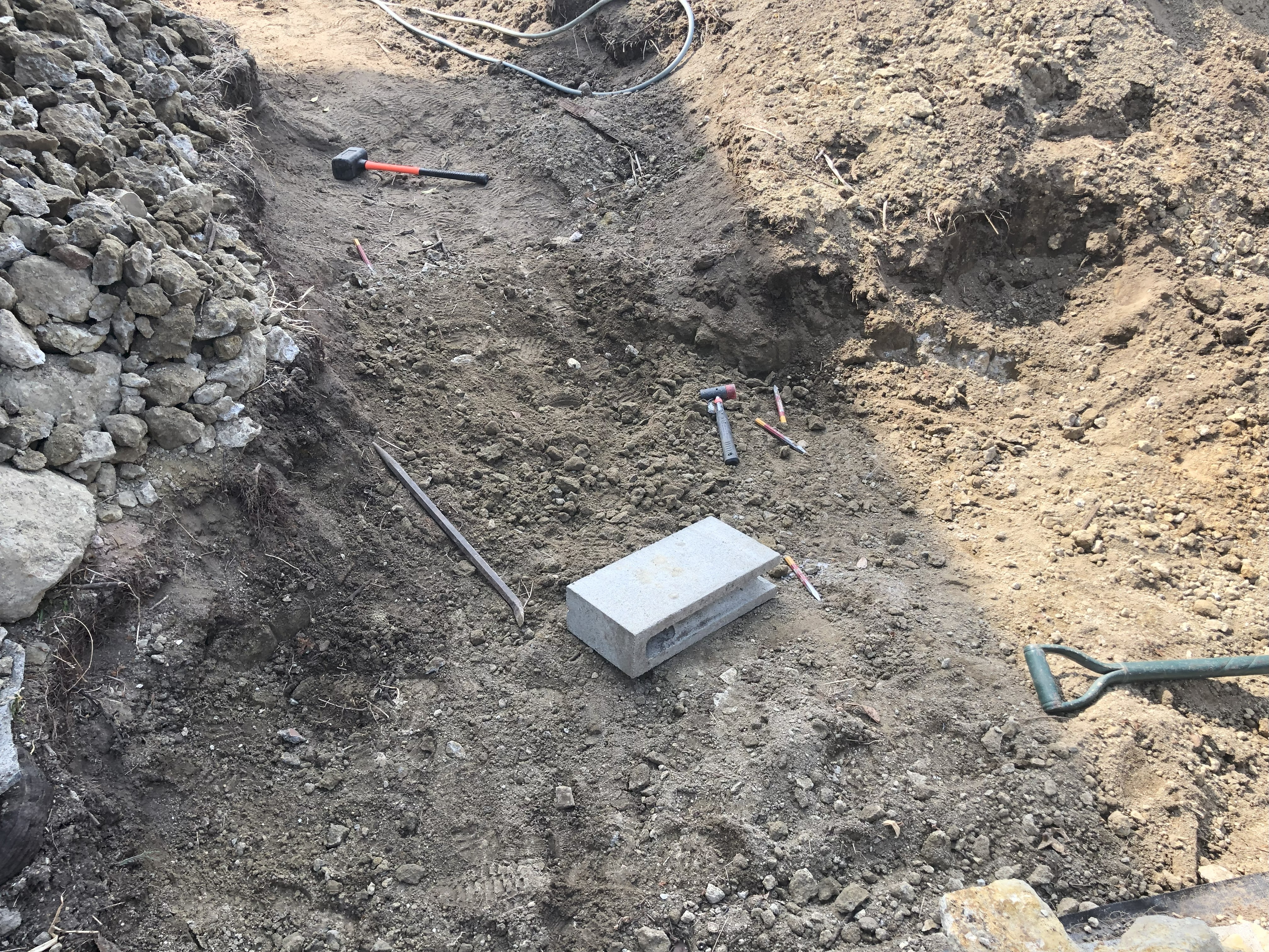 Continuing rock breaking work across the bed
